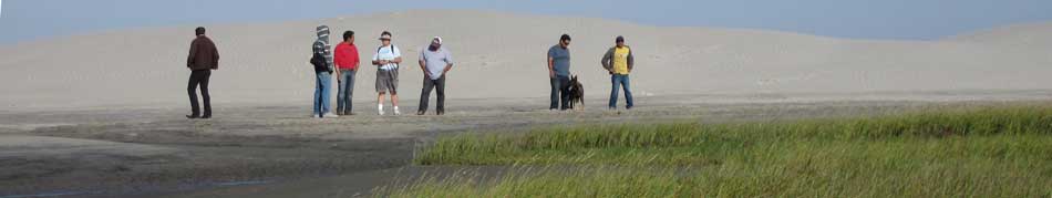 Giving talk to students of alternative tourism class at Dunas Doradas San Miguelito, Guerrero Negro; marsh plants in foreground